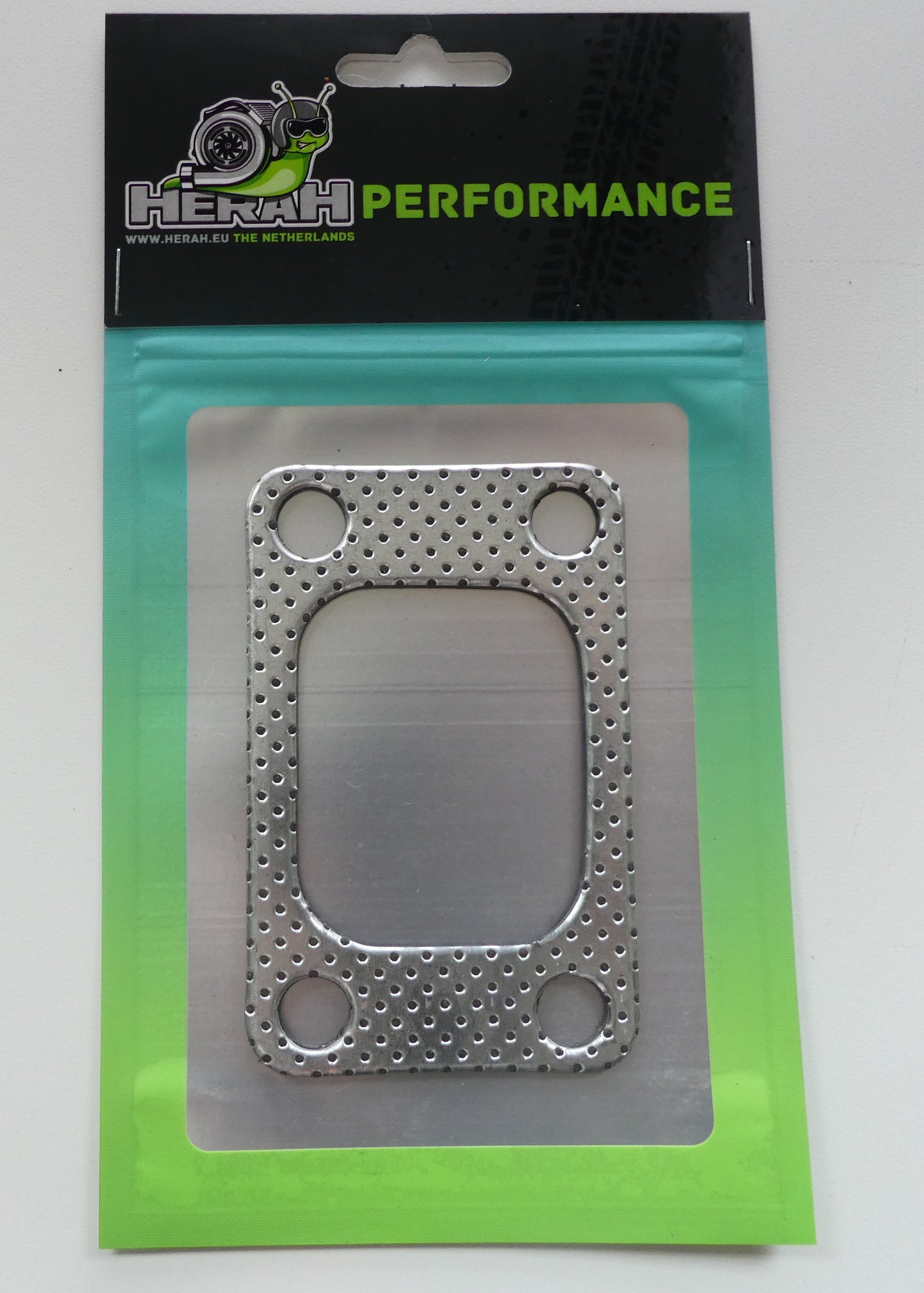 Metal gasket in packaging with 'HERAH PERFORMANCE' branding on a white background