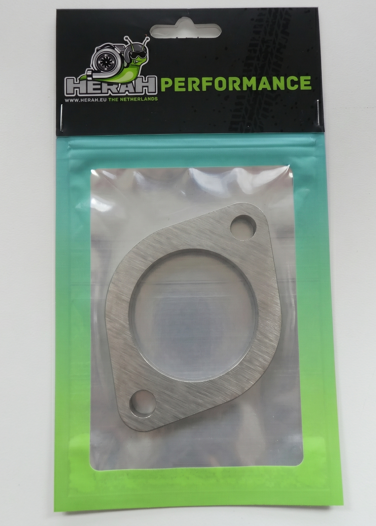 Exhaust flange on a Herah Performance packaging with a clear window