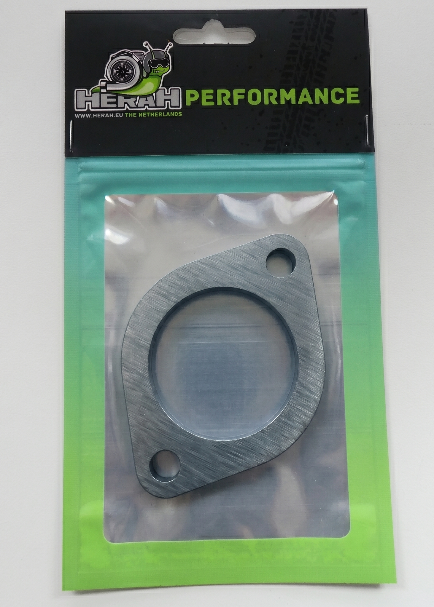 Exhaust flange on a Herah Performance packaging with a clear window