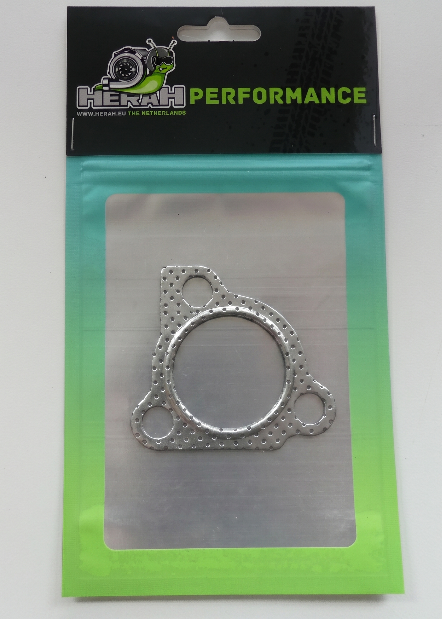 Metal gasket in packaging with 'Herah Performance' branding on a white background