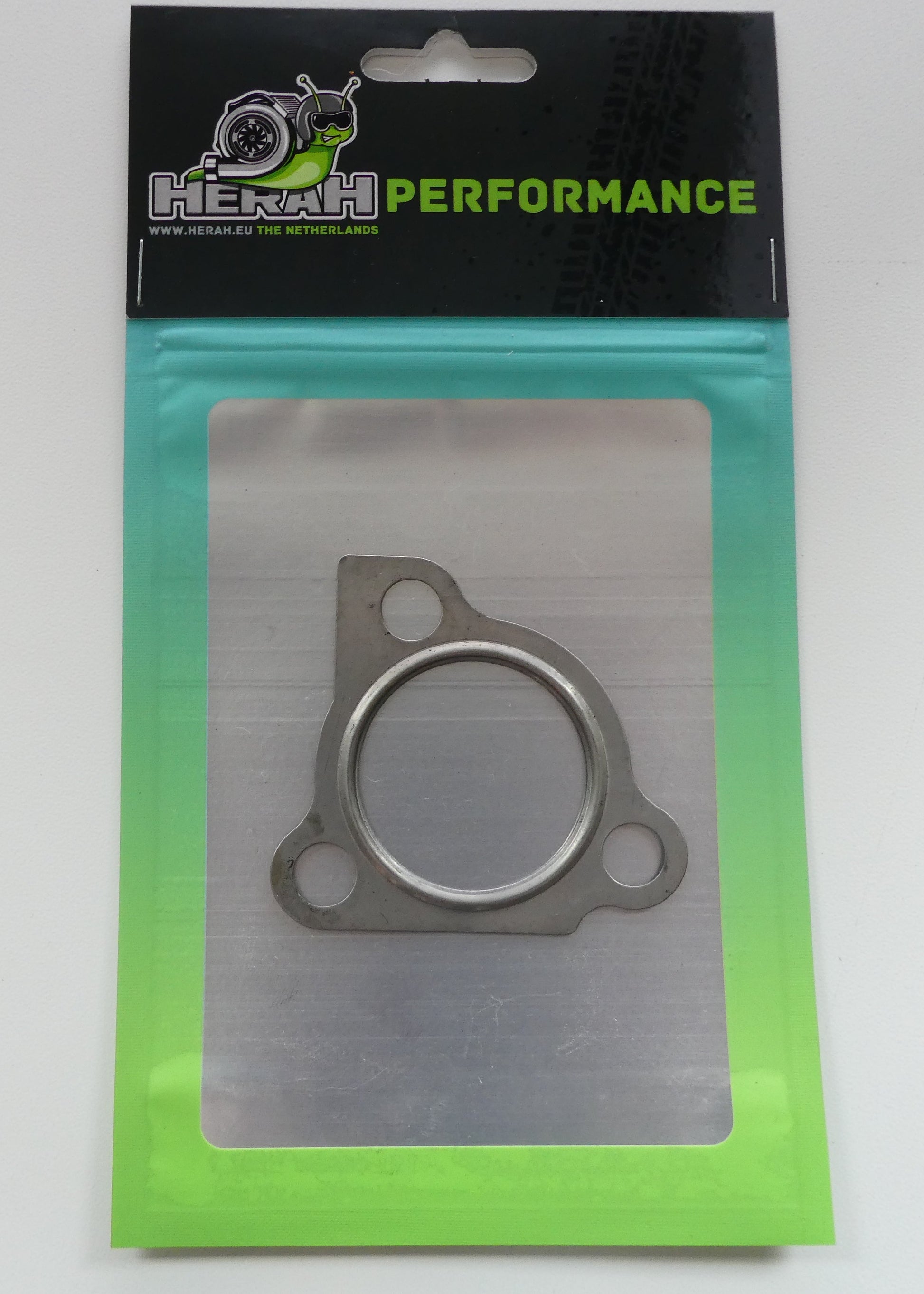 Metal gasket in packaging with 'Herah Performance' branding on a white background
