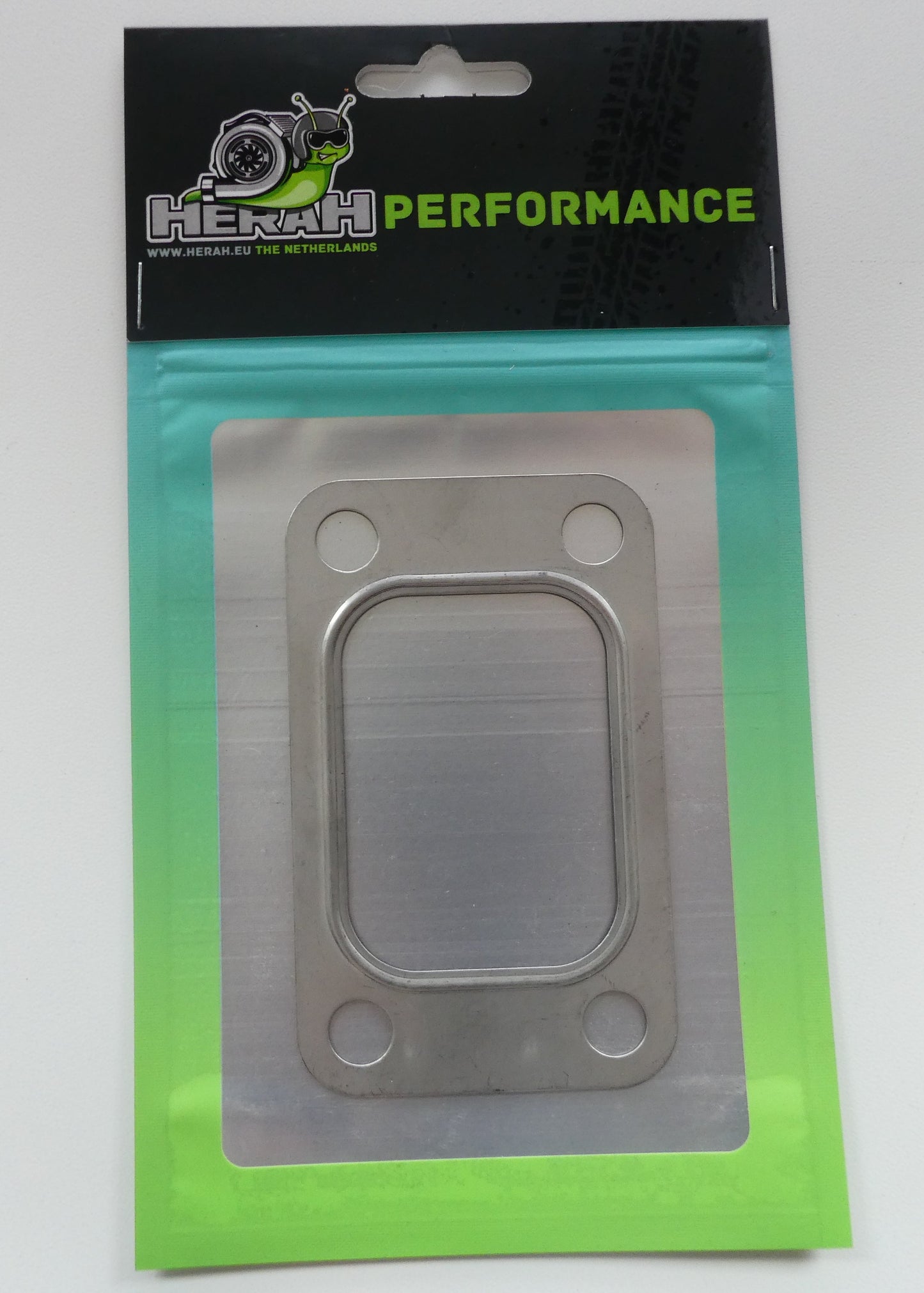 Metal gasket in packaging with Herah Performance branding on a white background