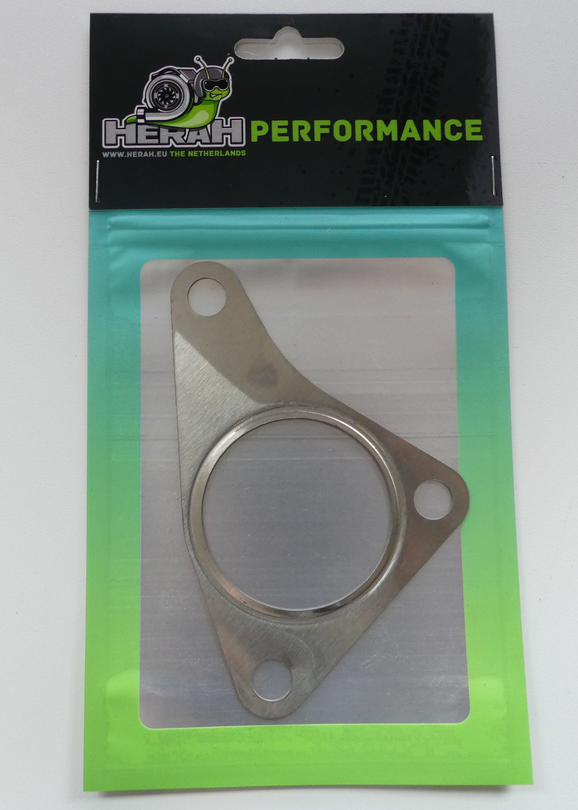 Metal gasket in packaging with 'HERAH Performance' branding on a white background